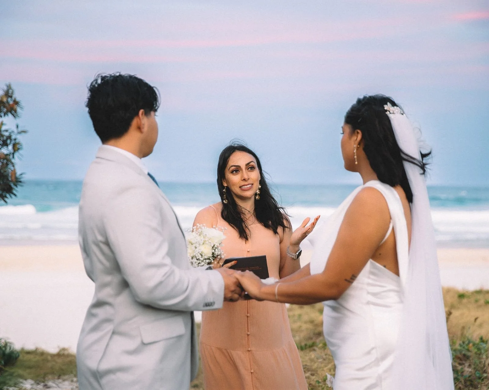 Ellie officiating an intimate wedding ceremony on the Gold Coast
