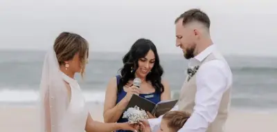 Ellie officiating a bilingual beach wedding ceremony