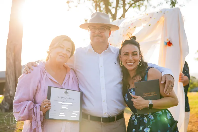 Ellie celebrating an outdoor wedding ceremony at golden hour